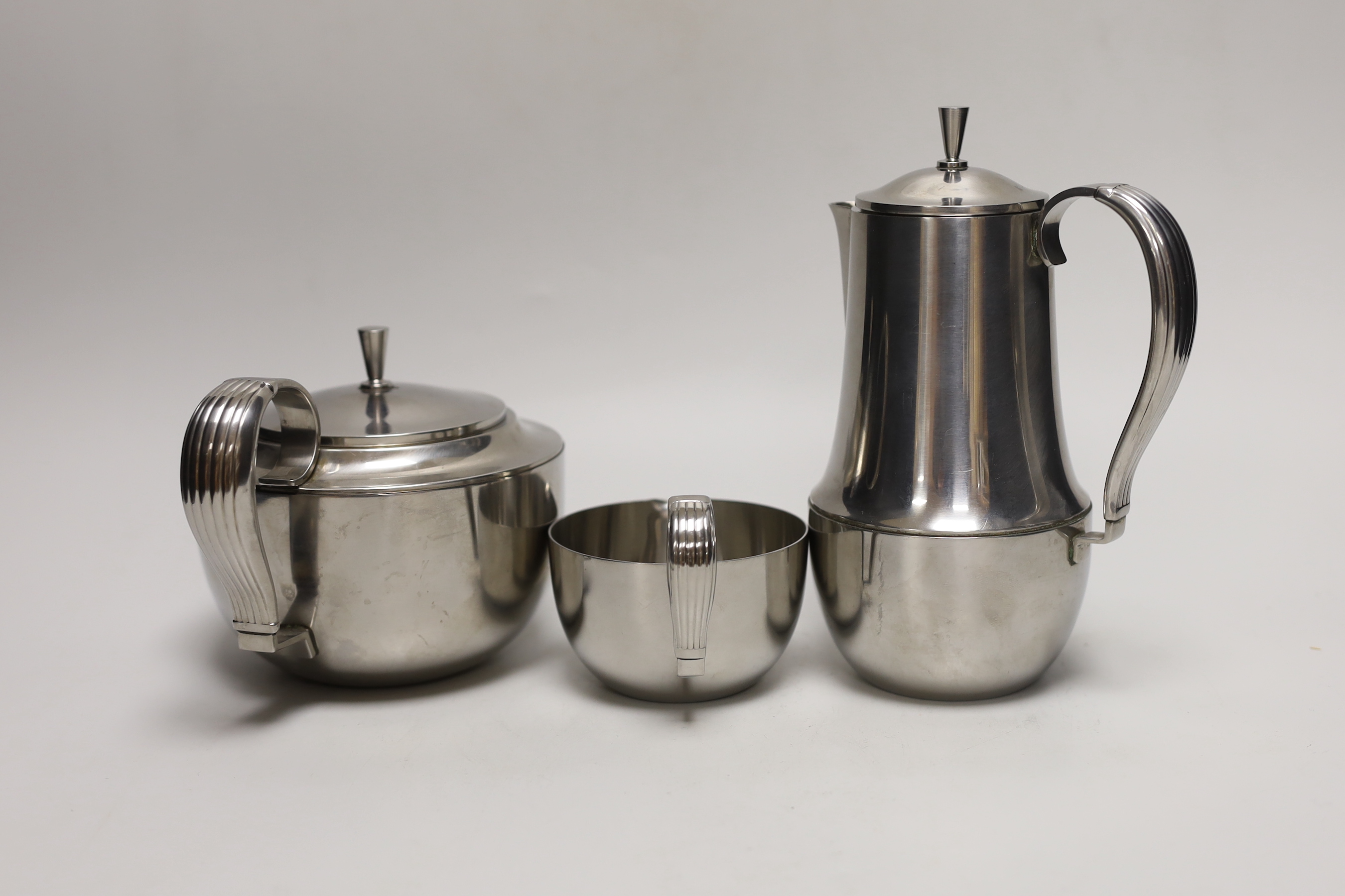 A Georg Jensen stainless steel three piece teaset